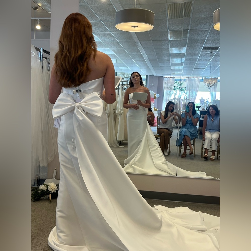 Never used Oxford street wedding dress. Not altered. Cathedral length.